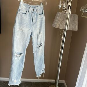 Distressed light wash denim in excellent condition